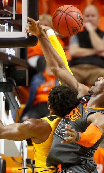Balanced scoring, stifling defense lead WV over Okla. St.